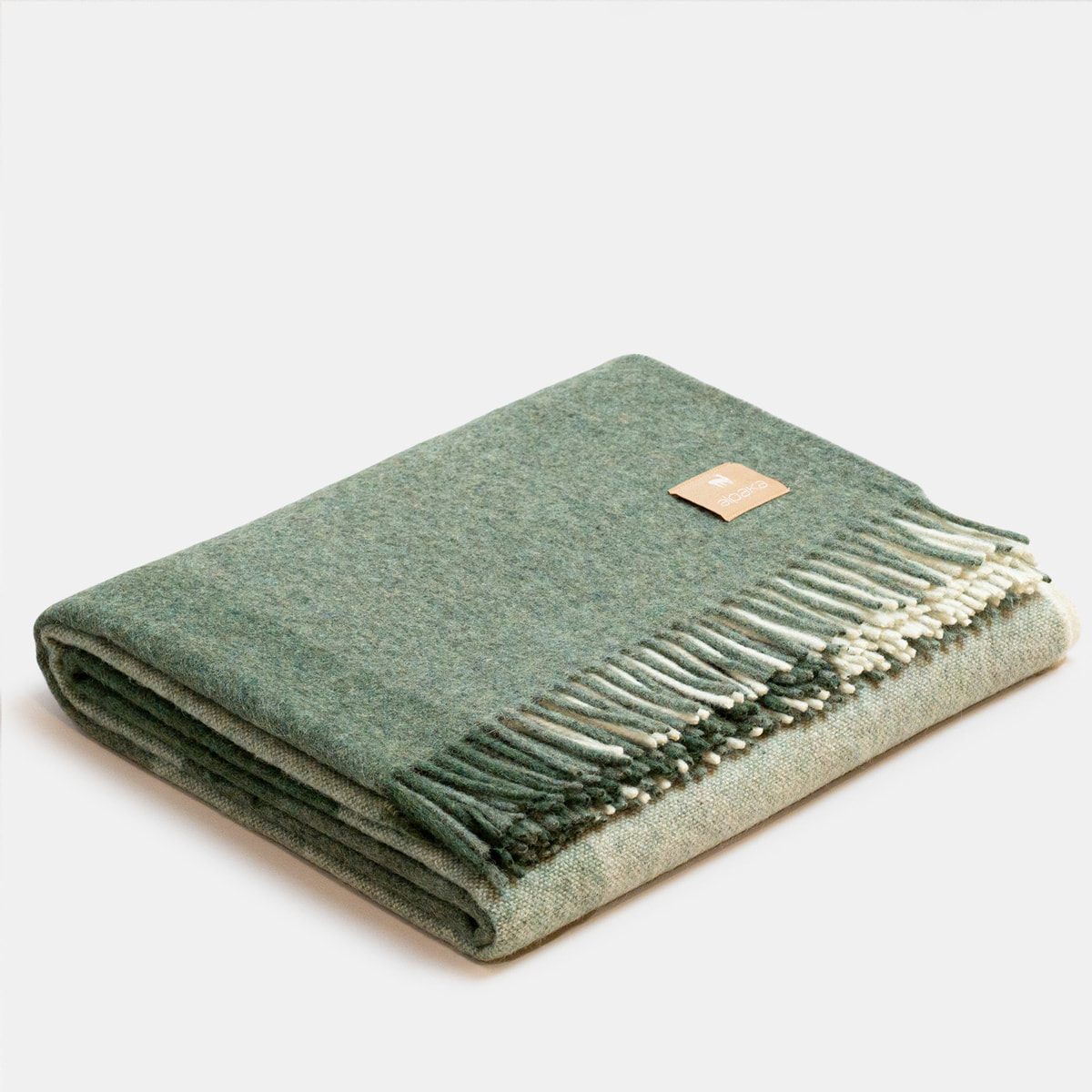 ALPAKA Classic Check Green throw showing folded on white background