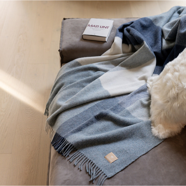 ALPAKA Classic Check recycled alpaca wool throw draped over a sofa
