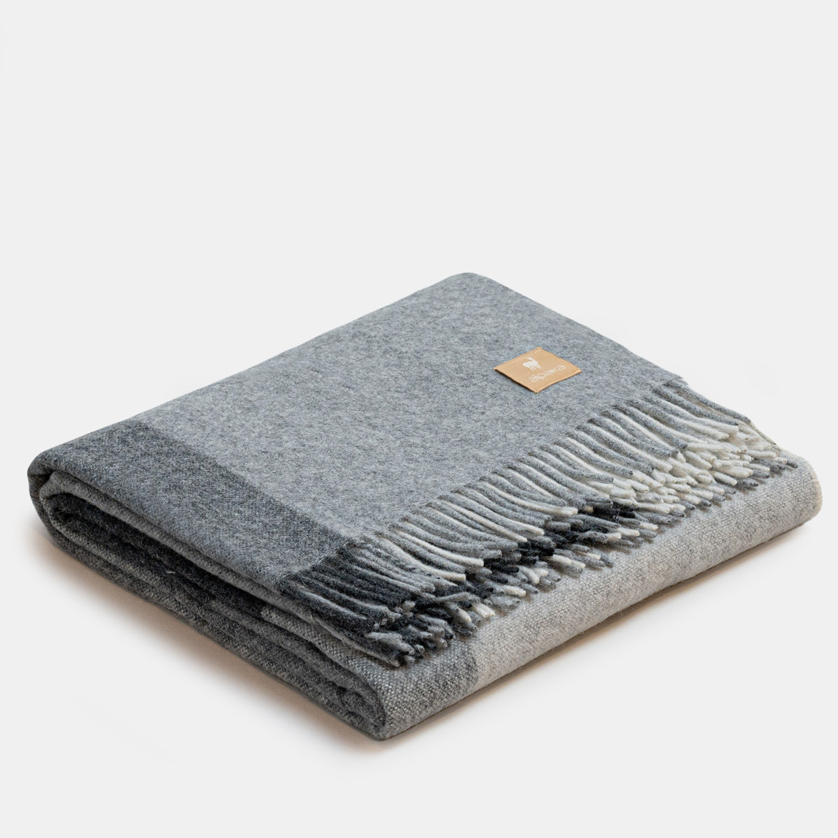 ALPAKA Classic Check throw showing folded on white background
